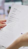 Vertical HR employers analyzing candidate CV after the job interview, carefully evaluating all qualifications and business administration knowledge or experience. Selection process for employment. Camera A. video