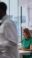 Vertical Headhunters team going through selection process by reviewing CVs after interview with all the job candidates, looking to hire personnel. HR recruiters evaluating resumes for job offer. Camera B. video