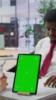Vertical Interviewer and candidate meeting for an interview next to green screen, HR manager asking questions about qualifications and business administration expertise. Recruitment process. Camera B. video