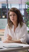 Vertical Unsuitable furious woman gets angry after getting rejected from the job offer, screaming and throwing papers around during interview with recruiter. Crazy displeased unqualified applicant. Camera A. video