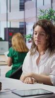 Vertical Staff interviewing woman applicant job seeker in high end office, evaluating her qualifications and talent. HR recruiter looking for personnel with experience in business administration. Camera B. video