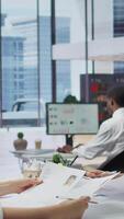 Vertical Recruiter rejecting an unqualified job candidate during the selection process, writes the refusal on their resume. HR team not pleased with unsuitable unprepared applicants, CV evaluation. Camera B. video