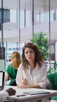 Vertical Unsuitable furious woman gets angry after getting rejected from the job offer, screaming and throwing papers around during interview with recruiter. Crazy displeased unqualified applicant. Camera B. video