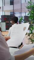 Vertical Team of recruiters working together to choose the right applicant with the best qualifications to fill in the vacancy. HR experts selecting candidates based on their resume, job offer. Camera B. video