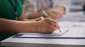 HR recruiters interviewing a job seeker and taking notes during meeting, attending an interview and conducting an evaluation. Headhunters and applicant in recruitment process. Close up. Camera A. video