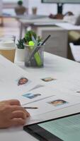 Vertical Team of recruiters selecting candidates based on their resumes, looking for the right person to fill in job vacancy. HR staff evaluating the qualifications of applicants after interview. Camera B. video