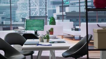 Empty modern office workspace designed for job interviews to achieve business success, professionals using advanced technology for resumes selection during recruitment process. video