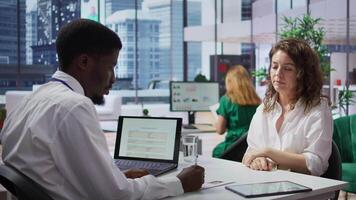Staff interviewing woman applicant job seeker in high end office, evaluating her qualifications and talent. HR recruiter looking for personnel with experience in business administration. Camera B. video