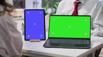 Team of recruiters interviewing job applicant with a green screen on desk, discussing about potential career development plans and his aspirations. Women attend an interview with candidate. Camera A. video