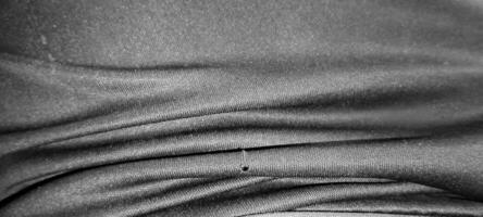 A picture of a black cloth folded in a beautiful way. photo