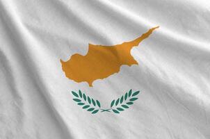 Cyprus flag depicted on folded wavy fabric of old cloth photo