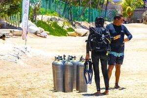 Playa del Carmen Quintana Roo Mexico 2023 Cylinders and diving equipment during preparation in Mexico. photo