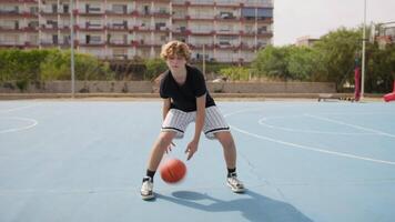 Young Italian Athlete Dribbles Under His Legs On The Basketball Court video