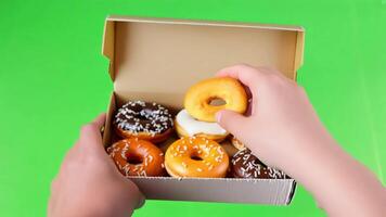 Box of Assorted Donuts on green screen background. video
