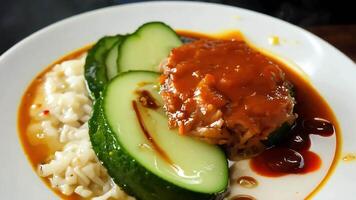 Delicious Plate of Rice with Sauce and Cucumbers. video