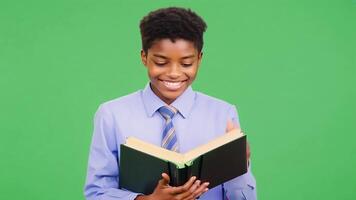 Smiling Student Holding Book in Classroom green screen background. video