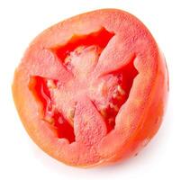 Tomato slice isolated over white background photo