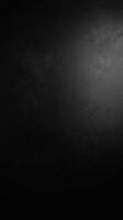 Black Textured Background with Subtle Light Reflection photo