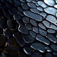 Abstract Black Textured Surface with Shiny Rounded Shapes photo