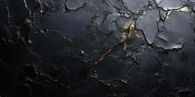 Black and Gold Textured Surface with Abstract Patterns photo