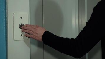 The man's hand presses elevator firmly on the button, highlighting the ease and simplicity of modern technology. Ideal for marketing and advertising projects to showcasing technological advancements. photo