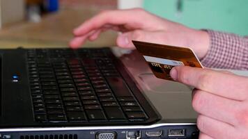 Male arms hold credit card press buttons making transfer closeup. Anti-fraud financial security when entering client discount program number or filling personal credential password login to account photo