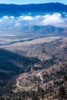 Beautiful mountain scenery on the background of clouds, layers of mountains on the horizon, Sierra Nevada Mountains, California, USA photo