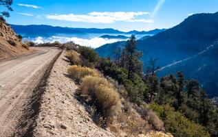 Beautiful mountain scenery on the background of clouds, layers of mountains on the horizon, Sierra Nevada Mountains, California, USA photo