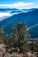 Beautiful mountain scenery on the background of clouds, layers of mountains on the horizon, Sierra Nevada Mountains, California, USA photo
