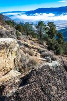 Beautiful mountain scenery on the background of clouds, layers of mountains on the horizon, Sierra Nevada Mountains, California, USA photo