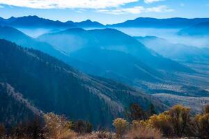 Beautiful mountain scenery on the background of clouds, layers of mountains on the horizon, Sierra Nevada Mountains, California, USA photo
