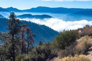 Beautiful mountain scenery on the background of clouds, layers of mountains on the horizon, Sierra Nevada Mountains, California, USA photo