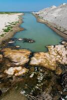 Closed canal from the Black Sea to Tuzla Estuary, bloom of stagnant water in the canal photo