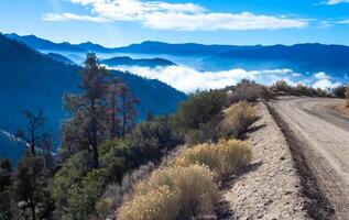Beautiful mountain scenery on the background of clouds, layers of mountains on the horizon, Sierra Nevada Mountains, California, USA photo