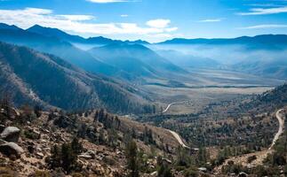Beautiful mountain scenery on the background of clouds, layers of mountains on the horizon, Sierra Nevada Mountains, California, USA photo
