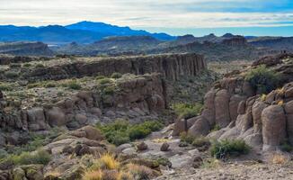 Mountain erosion formations of red mountain sandstones, Desert landscape with cacti, Arizona photo