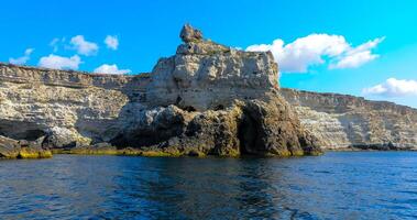 High Coastal cliffs from layered Pontic limestone in the western Crimea, Tarkhankut photo