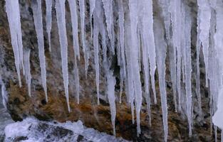 Icicles on a rock near the frozen Black Sea, The harsh winter of 2011 photo
