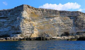 High Coastal cliffs from layered Pontic limestone in the western Crimea, Tarkhankut photo