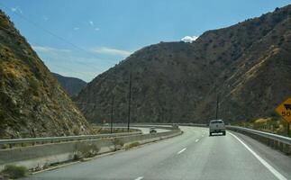 CALIFORNIA, USA - NOVEMBER 27, 2019 car on the road in a mountain canyon in California photo