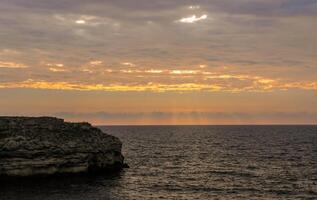 Beautiful Sunset in the clouds over the Black Sea in eastern Crimea photo