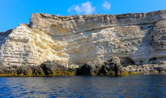 High Coastal cliffs from layered Pontic limestone in the western Crimea, Tarkhankut photo