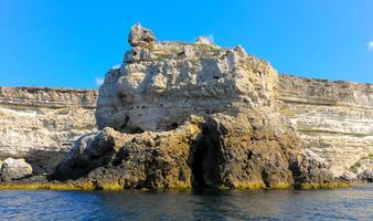 High Coastal cliffs from layered Pontic limestone in the western Crimea, Tarkhankut photo