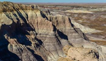 The Painted Desert on a sunny day. Diverse sedimentary rocks and clay washed out by water. Petrified Forest National Park, USA, Arizona photo