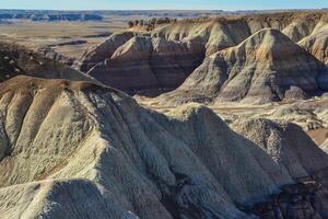 The Painted Desert on a sunny day. Diverse sedimentary rocks and clay washed out by water. Petrified Forest National Park, USA, Arizona photo
