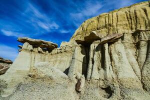 Weird sandstone formations created by erosion at Ah-Shi-Sle-Pah Wilderness Study Area in San Juan County near the city of Farmington, New Mexico. photo