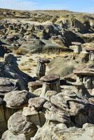 Weird sandstone formations created by erosion at Ah-Shi-Sle-Pah Wilderness Study Area in San Juan County near the city of Farmington, New Mexico. photo