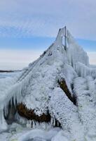 Coastal cliffs and coastal protection structures frozen with ice in the cold winter of 2010, the Black Sea photo