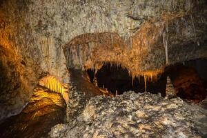 Calcite inlets, stalactites and stalagmites in large underground halls in Carlsbad Caverns National Park, New Mexico. USA photo