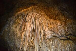 Calcite inlets, stalactites and stalagmites in large underground halls in Carlsbad Caverns National Park, New Mexico. USA photo